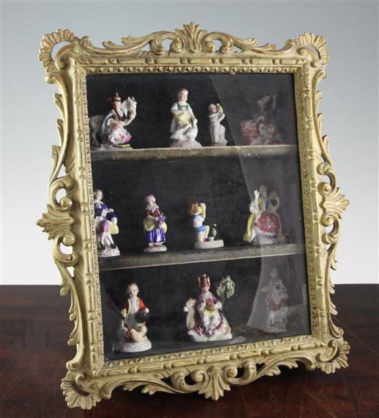 A collection of Chelsea style hard paste porcelain toy figures, 40.5 cm